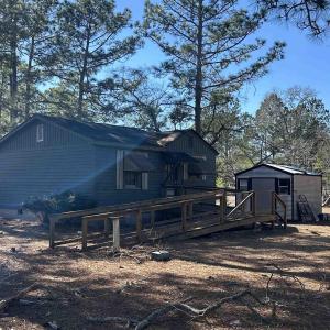 Rear view of property featuring crawl space and a