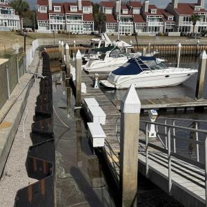 Dock area featuring a residential view and a water