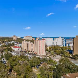 Birds eye view of property with a city view