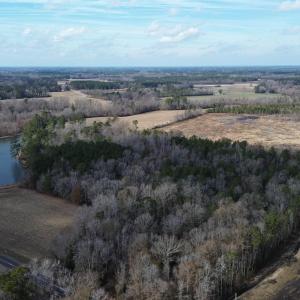 Aerial view featuring a water view and a rural vie