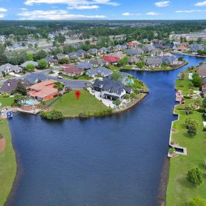 Aerial view featuring a water view and a residenti