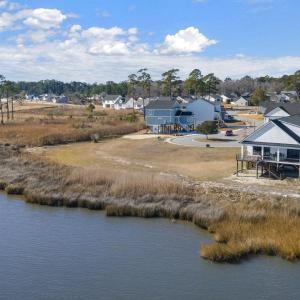 Birds eye view of property with a water view and a
