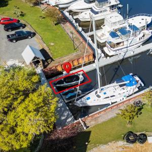 Birds eye view of property with a water view