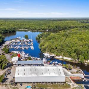 Birds eye view of property with a forest view and