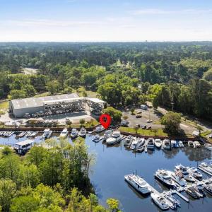 Birds eye view of property featuring a wooded view