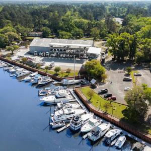 Drone / aerial view featuring a wooded view and a