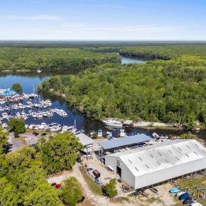 Bird's eye view with a forest view and a water vie