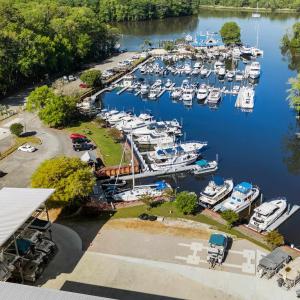 Birds eye view of property with a water view