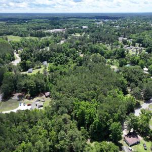 Aerial view featuring a forest view