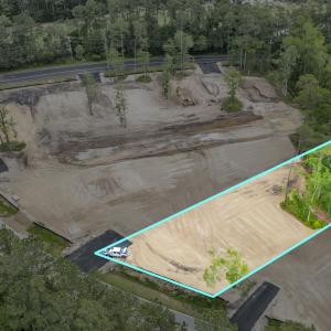 Birds eye view of property with a forest view