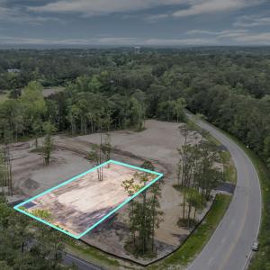Drone / aerial view featuring a wooded view