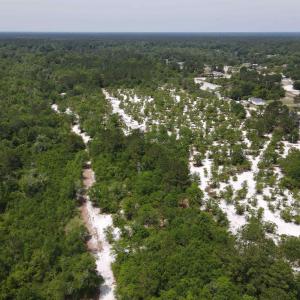Aerial view of property and surrounding area featu