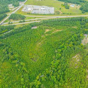Aerial view of property's location with a heavily