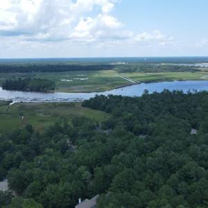 Drone / aerial view of a large body of water and a