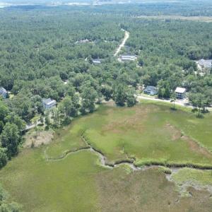View of property location featuring a forest and a