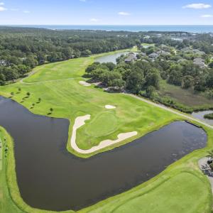 Drone / aerial view of a nearby body of water, a g