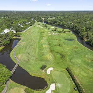 View of property location featuring a forest, a la
