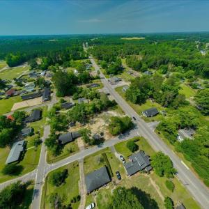View of property location featuring a forest and n