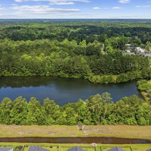 Aerial view of property and surrounding area with