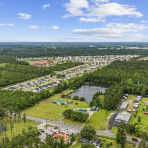 Aerial view of property and surrounding area featu