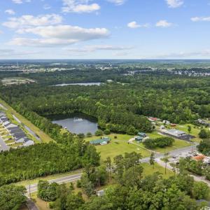 Aerial view of property's location with a large bo