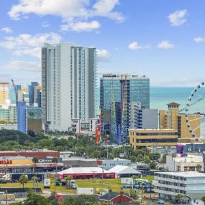 View of city skyline featuring a nearby body of wa