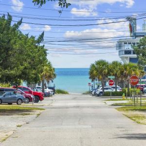 View of asphalt road featuring traffic signs