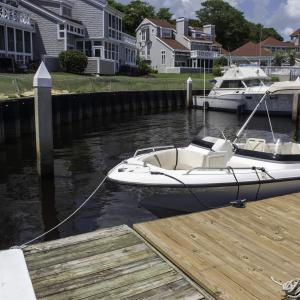 Dock area with a water view and a residential view