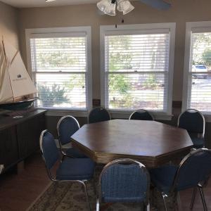 Dining area with wood finished floors, a ceiling f