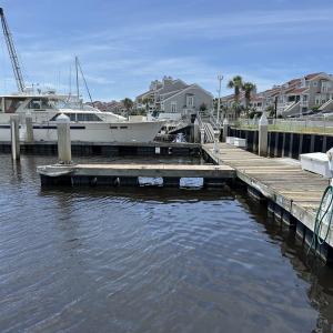 Dock area with a water view and a residential view