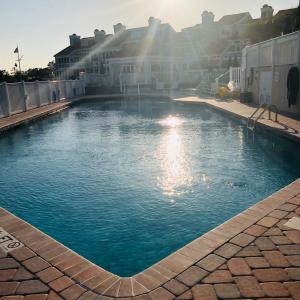 Community pool with a patio area