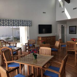 Dining space with a towering ceiling, wood finishe