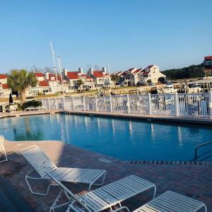 Community pool with a residential view