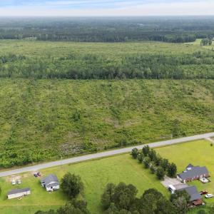 Aerial view of property and surrounding area with