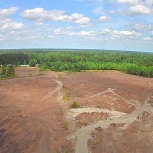 Aerial view of property and surrounding area with