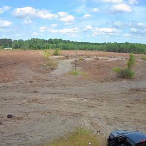 View of wooded area featuring a rural view