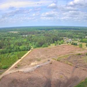 View of property location featuring a heavily wood