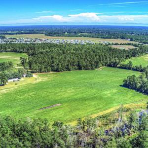 View of property location featuring a heavily wood
