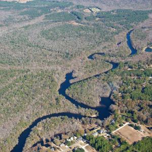 Aerial view of property and surrounding area with