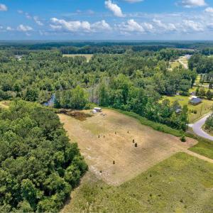Aerial view of property and surrounding area with