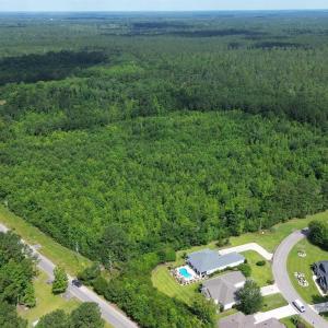 Aerial view of property and surrounding area with