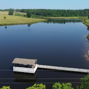 Aerial view of a nearby body of water and a heavil