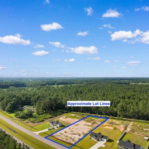 Aerial view of property and surrounding area with