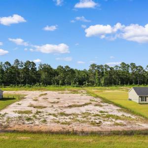 View of property's community featuring a lawn