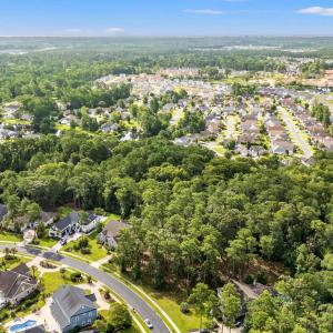 Aerial view of residential area featuring a heavil