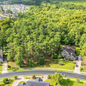 Aerial view of residential area featuring a heavil