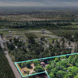 View of rural area with a forest and property parc