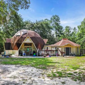 Back of property with a gambrel roof and view of w