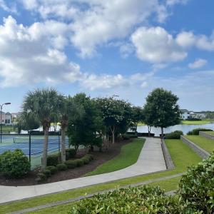 View of property's community with a pool and a pat