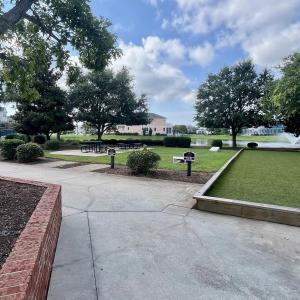View of sport court featuring a tennis court